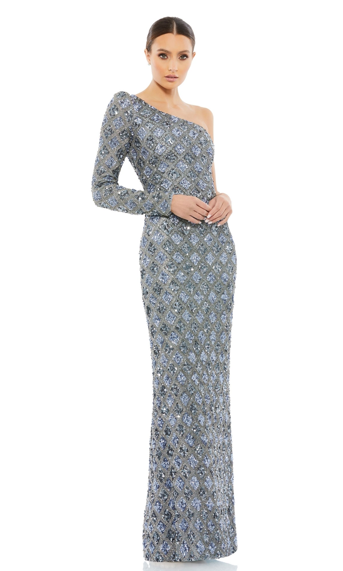 A woman wears the Long Formal Dress 5479 by Mac Duggal, a silver, floor-length one-shoulder dress adorned with sequins and a subtle geometric pattern, standing against a white background.